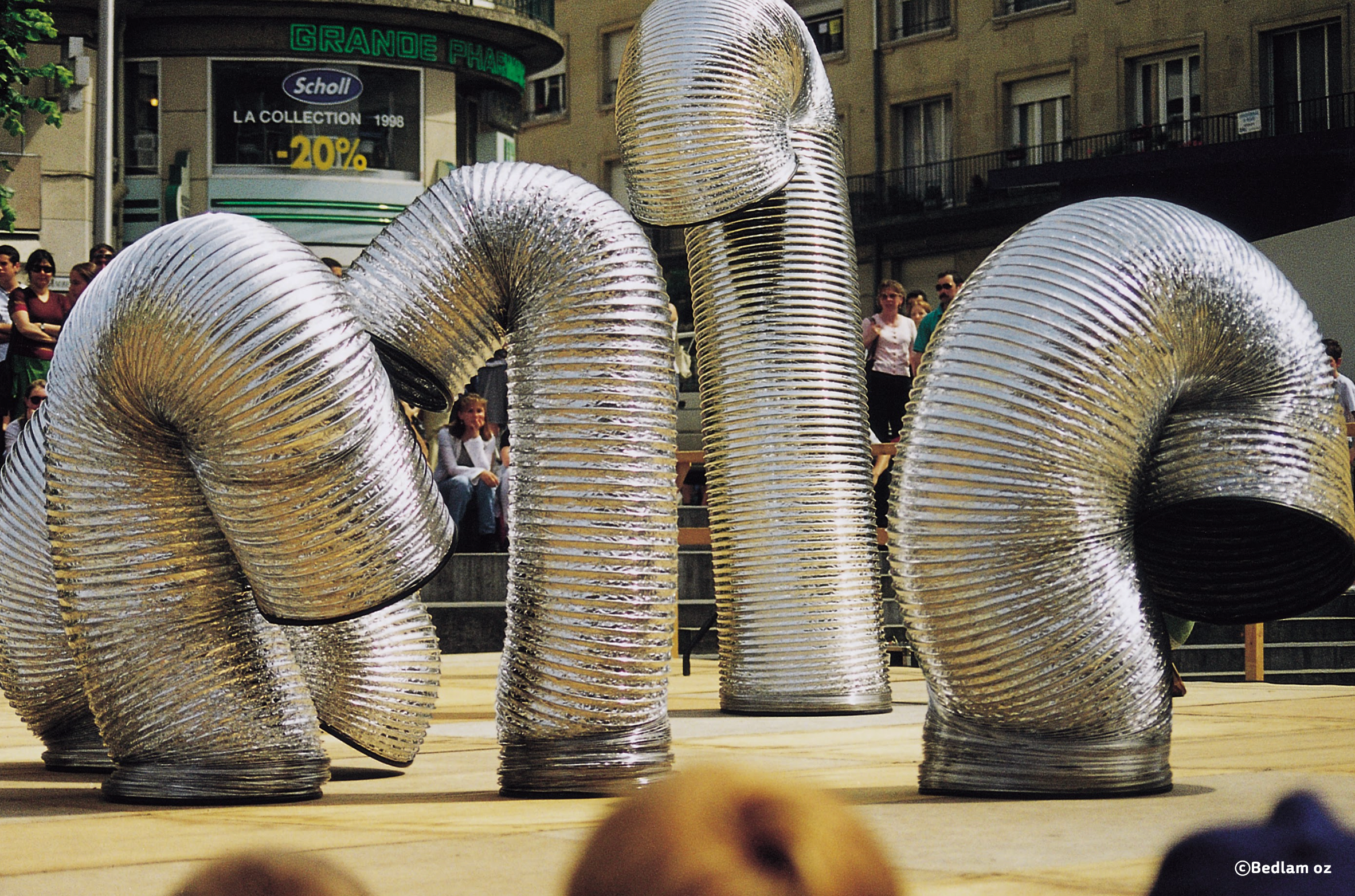A majestic parade of hyper flexible interactive slinkies with bursts of comic energy amongst the crowd.